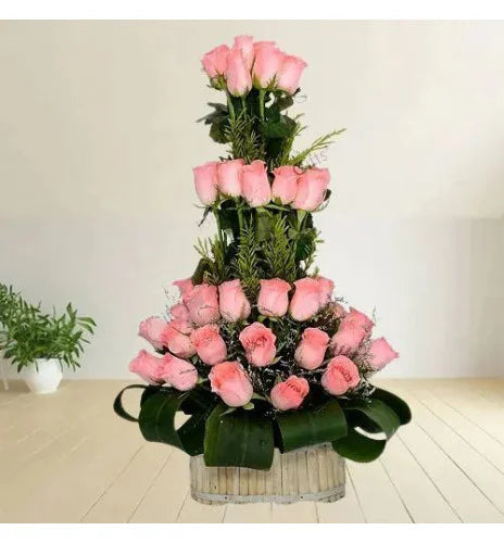 Beautiful Basket of Pink Roses with Leaves